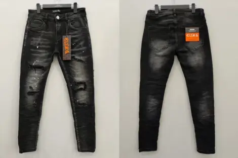 Jean Homme slim noir délavé déchirures et taches blanches.