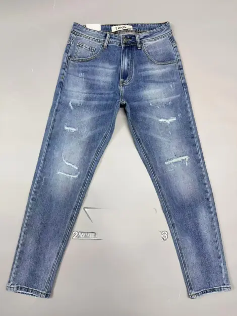 Jean uni bleu homme légèrement déchiré coupe SLIM FIT