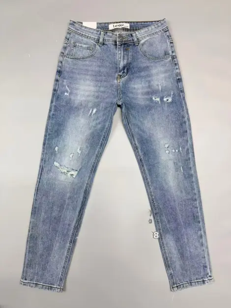 Jean uni bleu homme légèrement déchiré coupe SLIM FIT