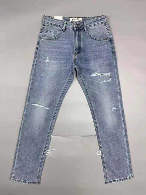 Jean uni bleu homme légèrement déchiré coupe SLIM FIT