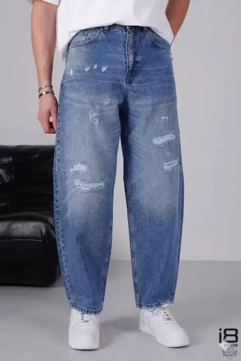 Jeans coupe baggy bleu homme déchirures travaillées à l'avant avec effet delave